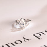 Stunning 1.0 - 2.0 CT Pear Moissanite Engagement Ring with Pave & Halo Design 1