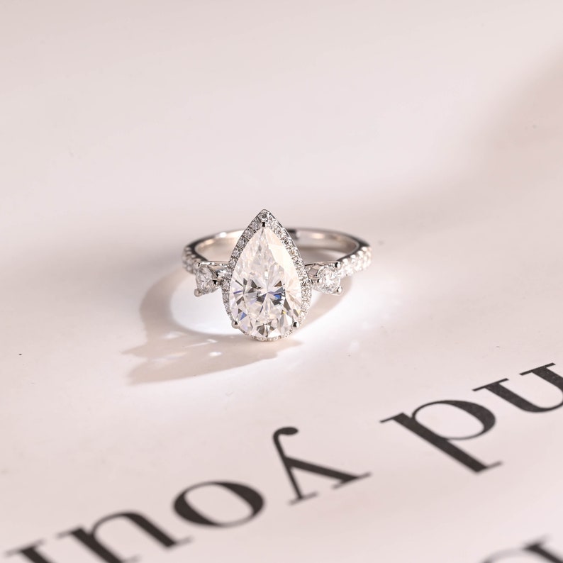 Stunning 1.0 - 2.0 CT Pear Moissanite Engagement Ring with Pave & Halo Design 1