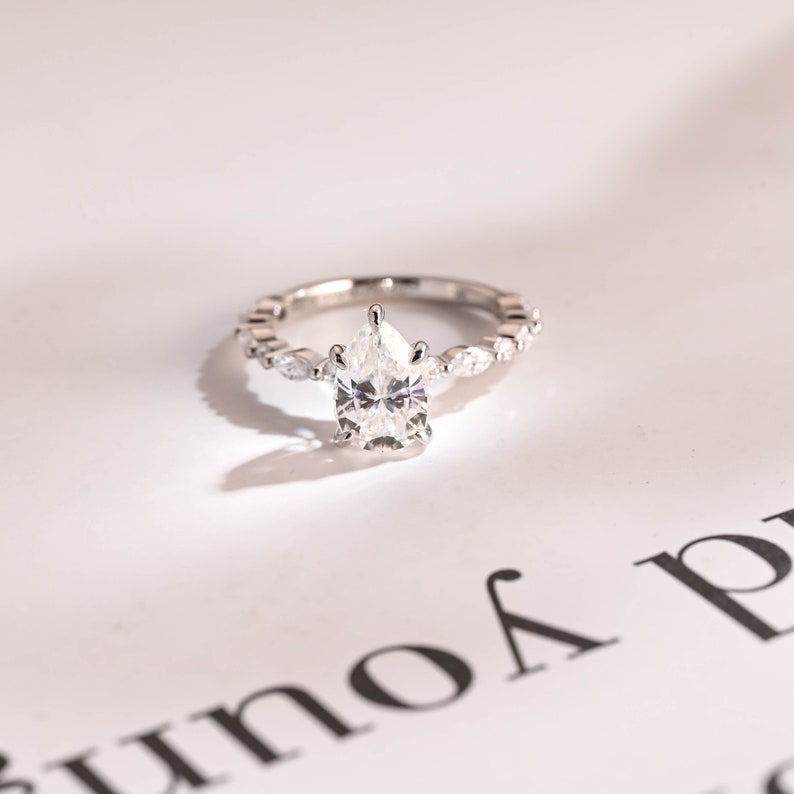Stunning 1.0 - 2.0 CT Pear Moissanite Engagement Ring with Pave Design 1