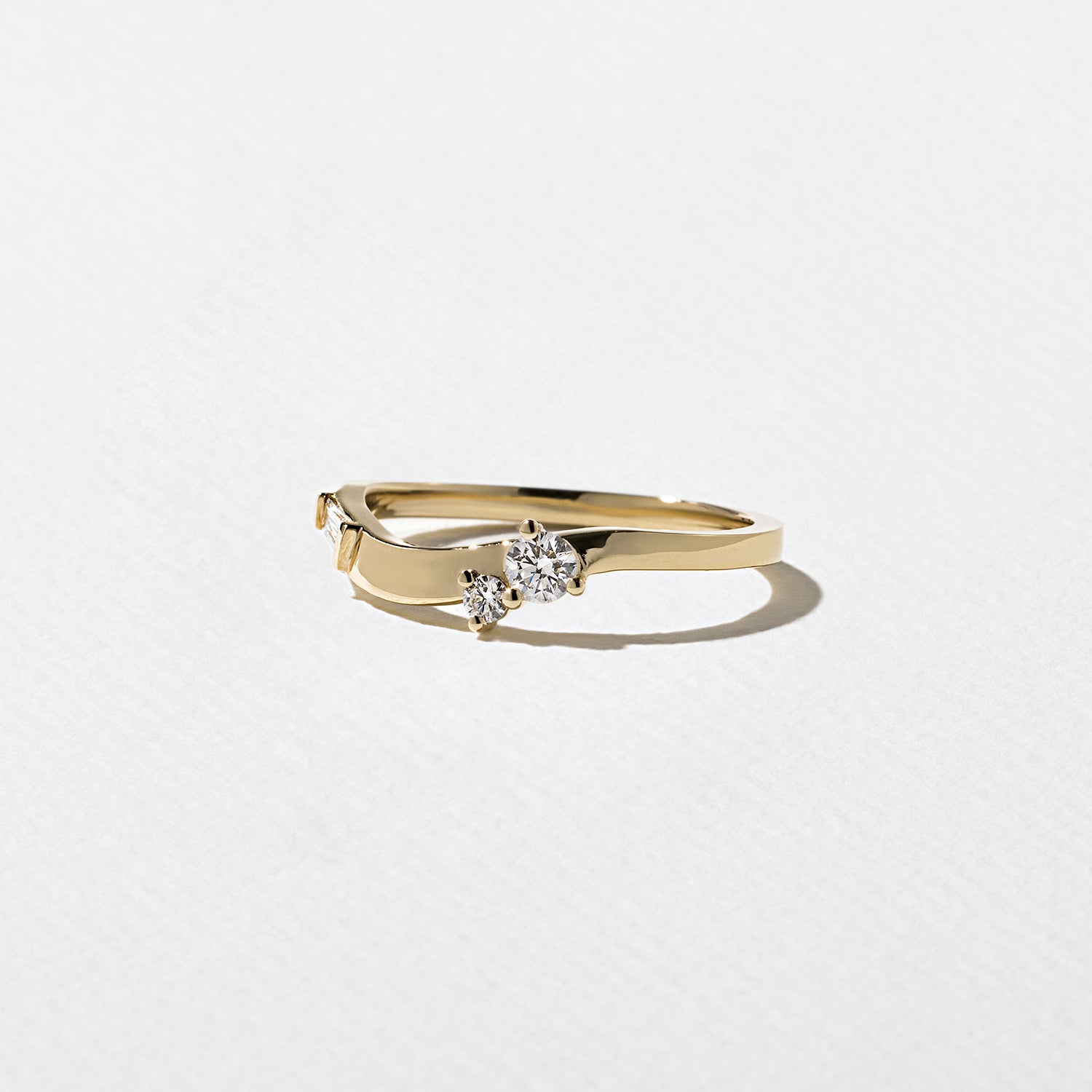 0.23 TCW Round, Tapered Baguette, and Pear unique Wedding Band