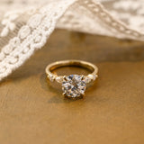 Solid Gold Round Cut Moissanite Engagement Ring with Accent Marquise
