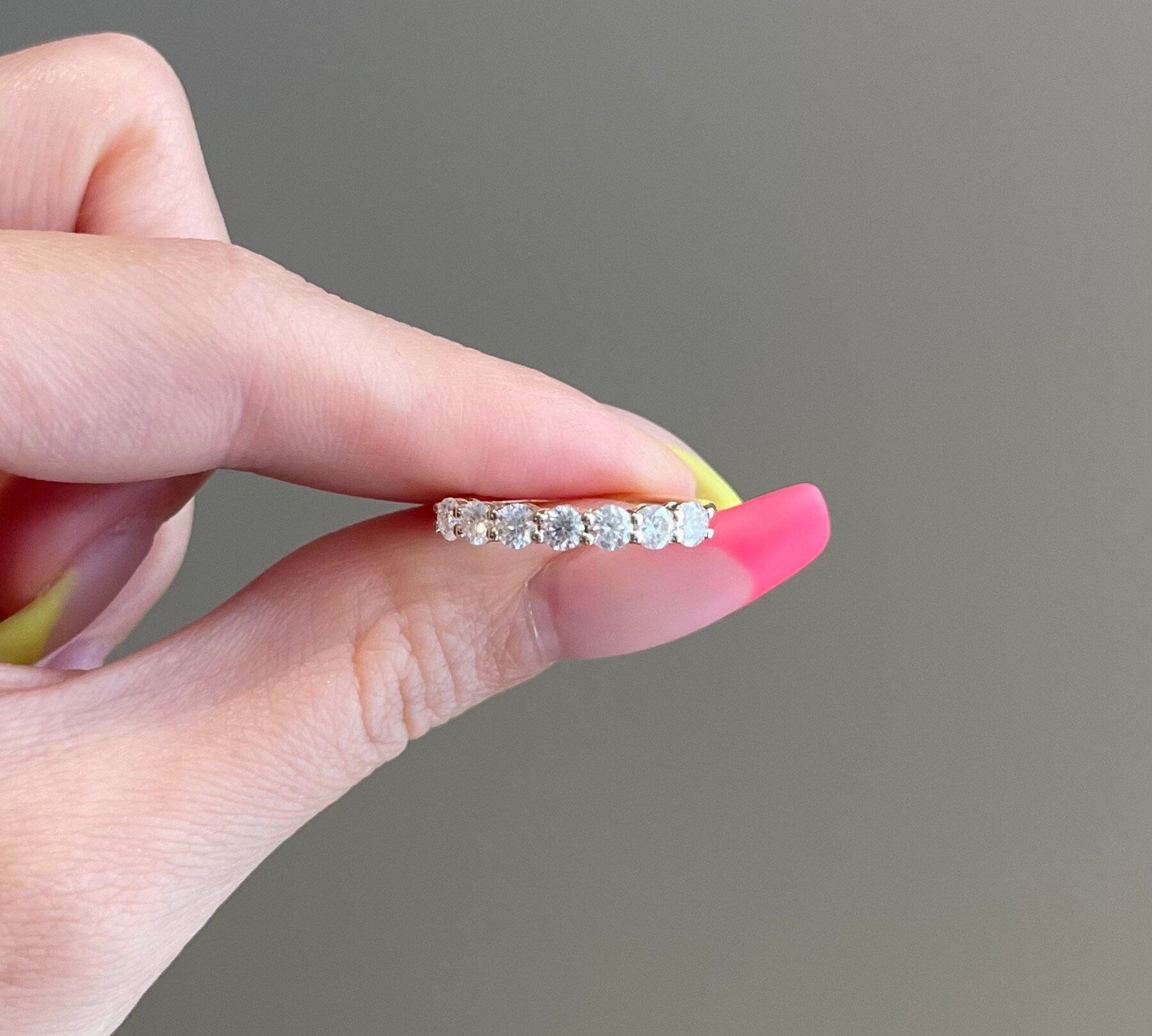 0.70 TCW Round Shaped Moissanite Seven Stones Wedding Band 1