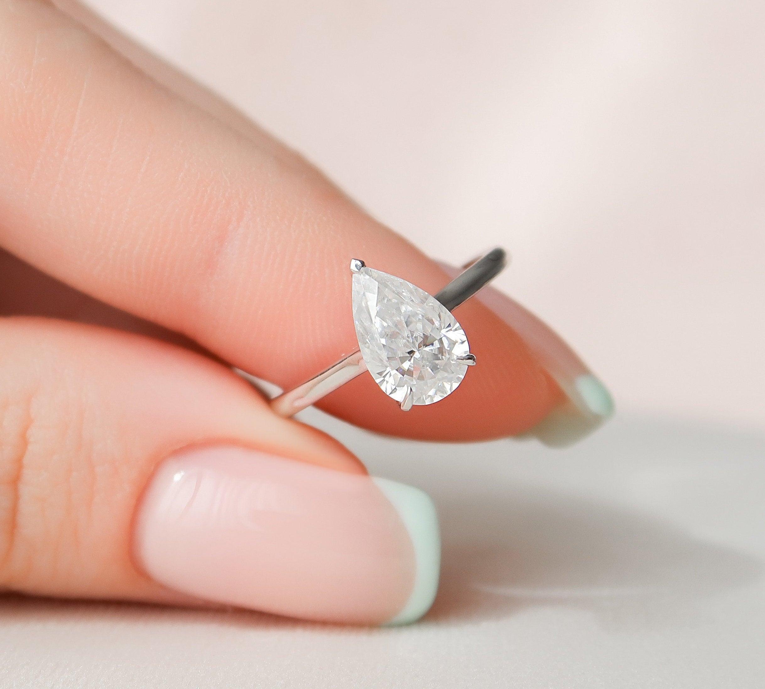 1.5 CT Pear Hidden Halo Moissanite Engagement Ring 1